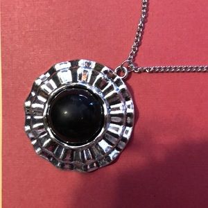 medallion on a very long silver chain